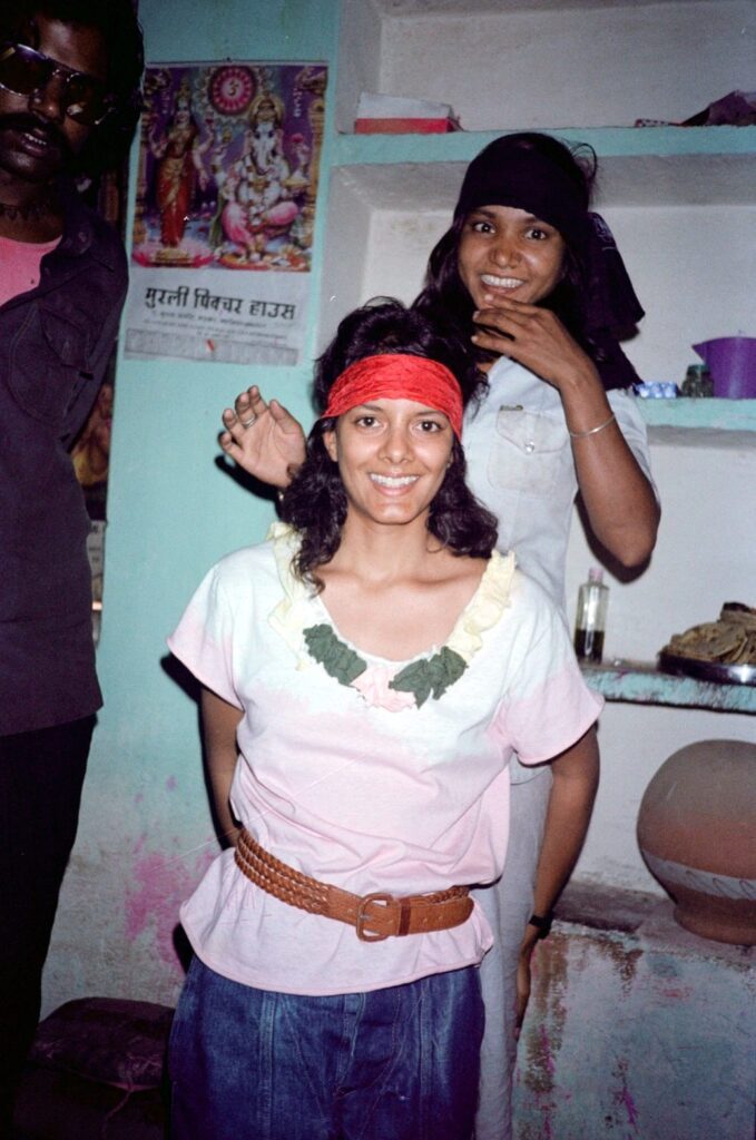 Phoolan Devi Gifting her Red Bandana to Susie Coelho - 1983 Susie Coelho wearing the red bandana Phoolan Devi gave her, with Phoolan behind her, 1983